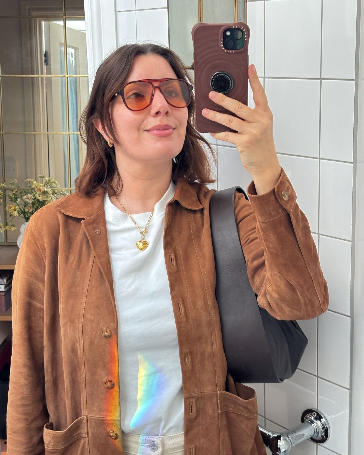 A woman taking a selfie with a blunt bob hairstyle