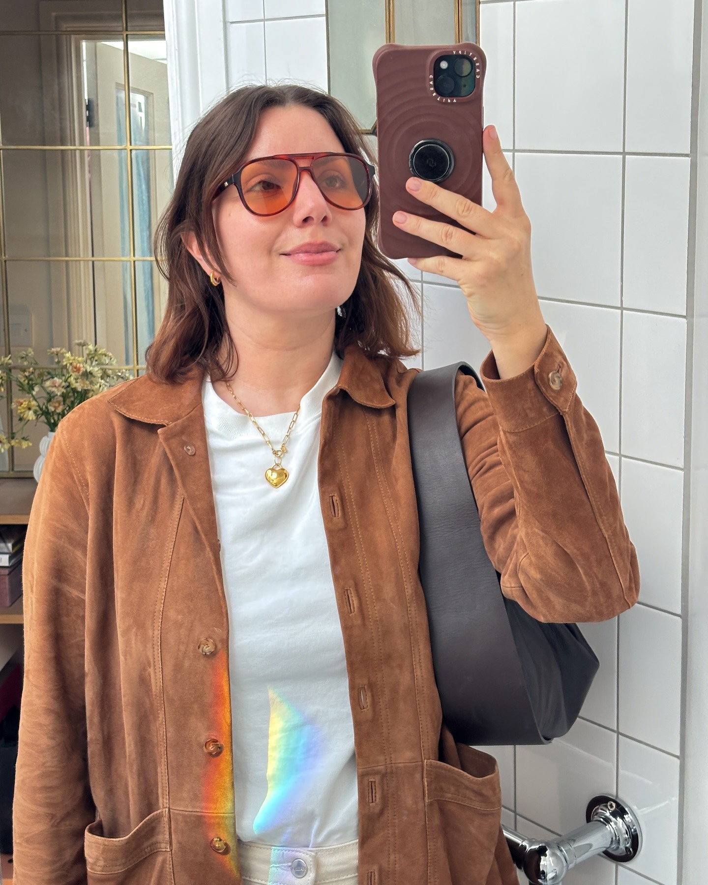 A woman taking a selfie with a blunt bob hairstyle