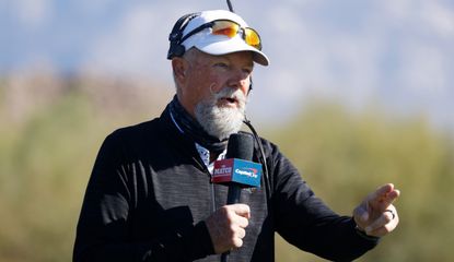 McCord talks into a microphone during the match