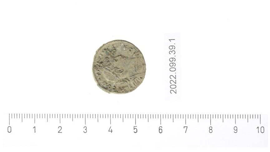 A coin dating back to the reign of Constantine I that was found near the watchtower. The coin is just under 2cm in width and has a side profile of a man on it.