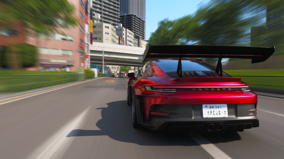Forza Horizon 6 best cars: The 2023 Porsche 911 GT3 RS racing down a Tokyo street.