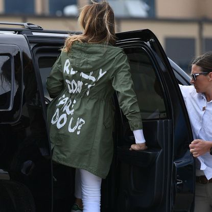 Vehicle door, Street fashion, Vehicle, Automotive exterior, Car, Outerwear, Automotive window part, Family car, Pedestrian, Gesture,