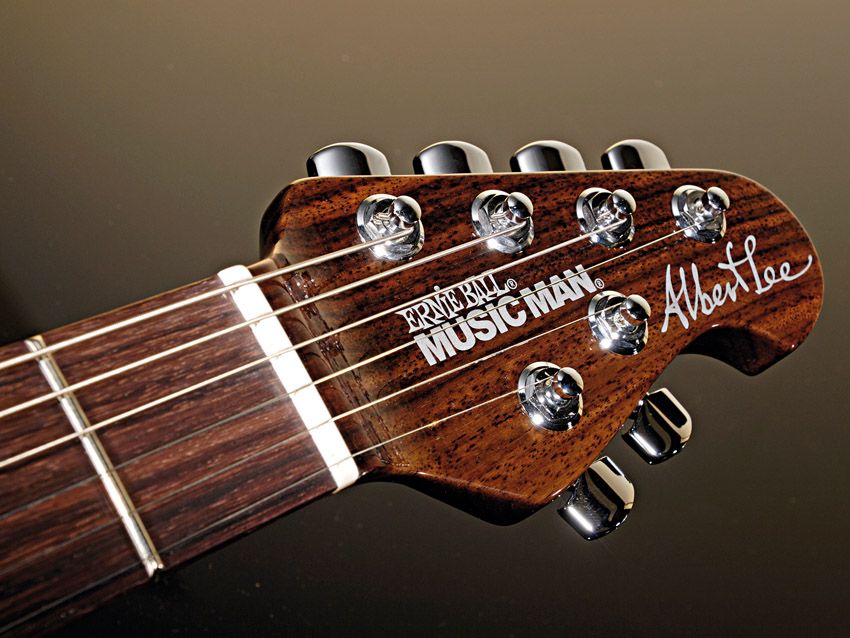The rosewood headstock sports Music Man's 'four and two' tuner arrangement