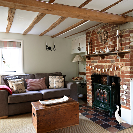 living room with grey sofa and fire place