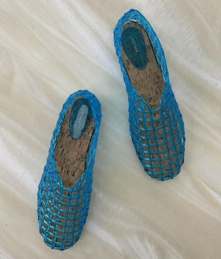 a pair of blue Mara jelly flats from The Row