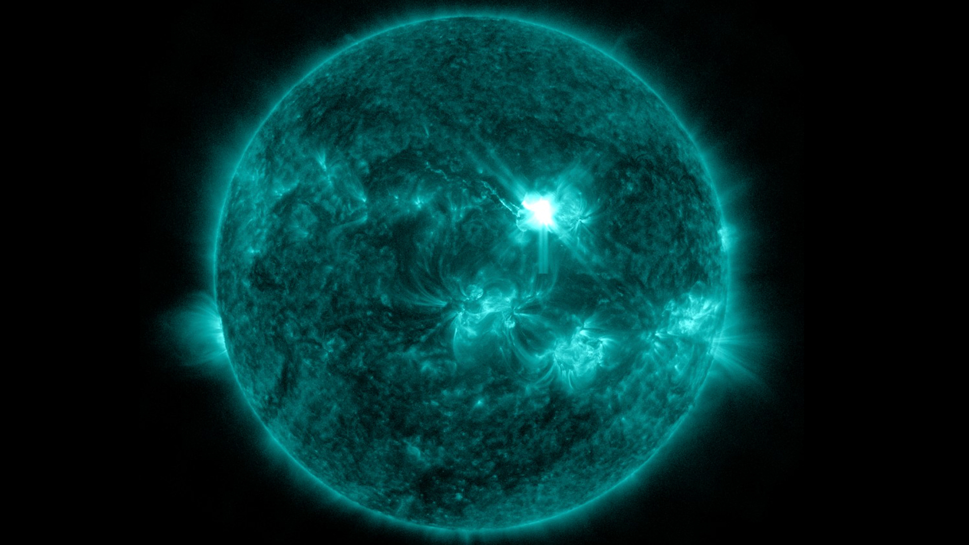 view of the sun showing a bright eruption near the center, this is the x-class flare erupting on June 30.