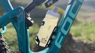 Bottle in Elite Prism bottle cage on mountain bike