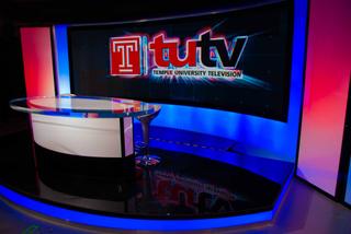 The TUTV set showing the Temple University Television name displayed on the Axion Series LED video panels.
