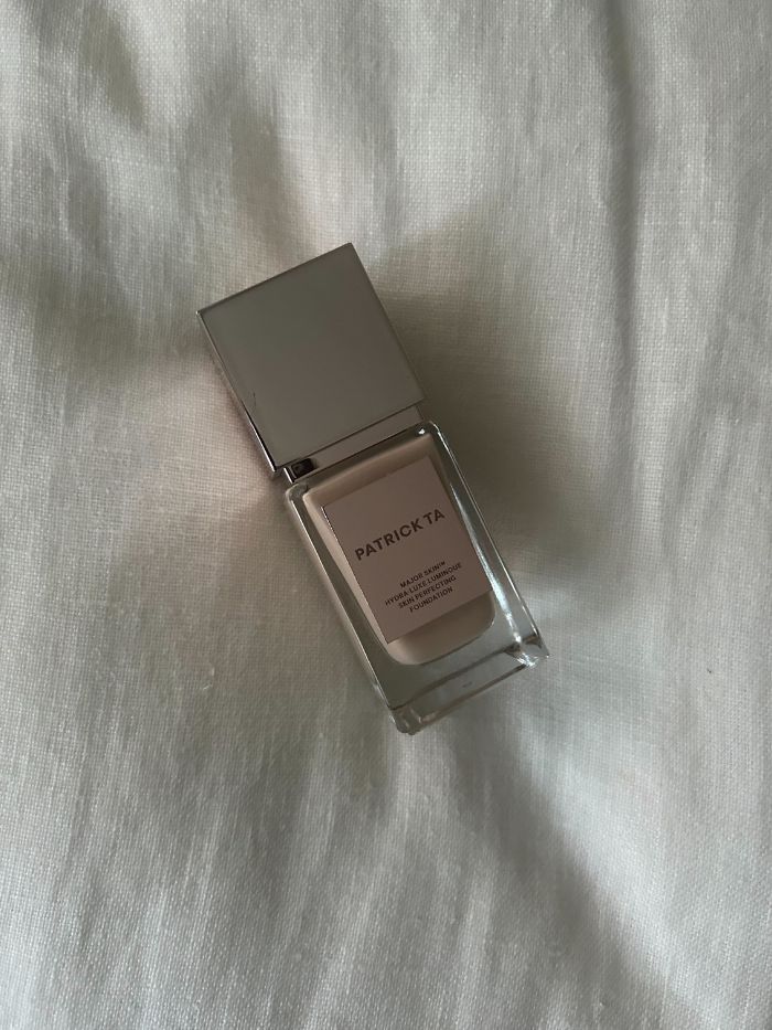 PATRICK TA Major Skin Hydra Luxe Skin Perfecting Foundation on a white linen background