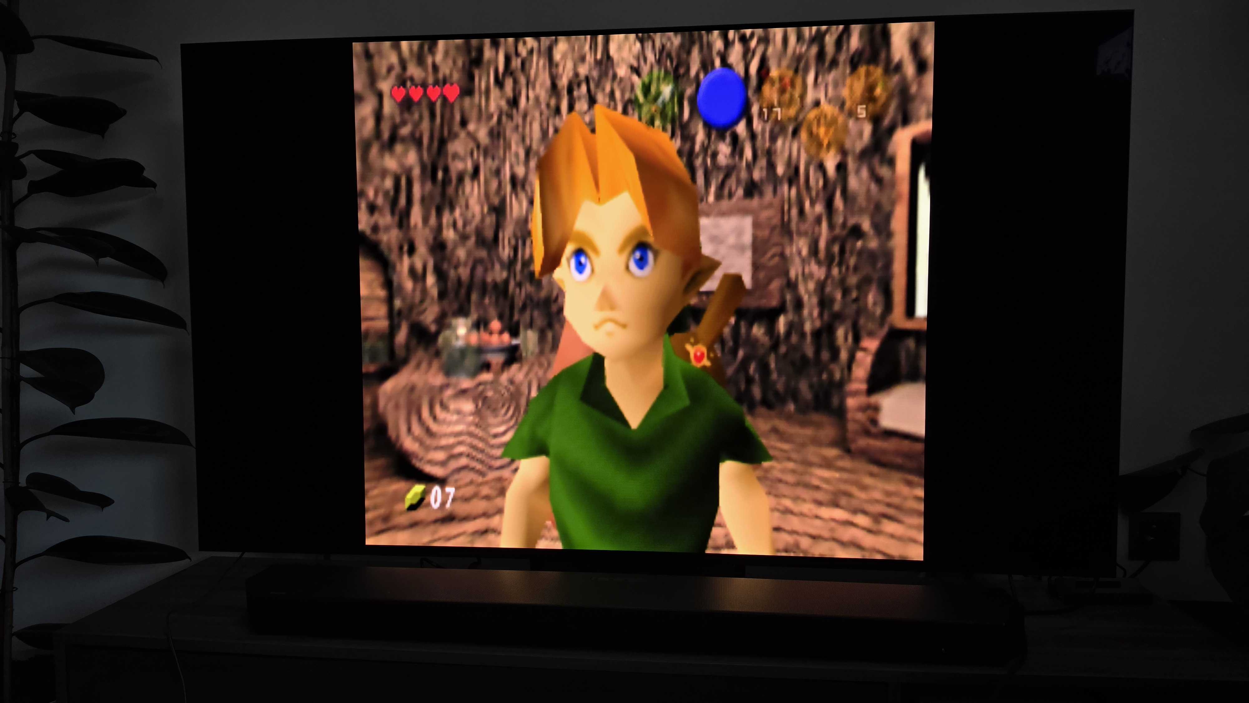 A TV showing a close-up of Link from Ocarina of Time being played on the ModRetro M64 upscaled to 4K