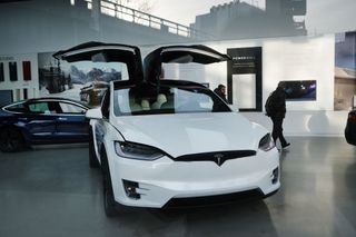 A tesla vehicle is displayed in a Manhattan dealership on January 30, 2020 in New York City