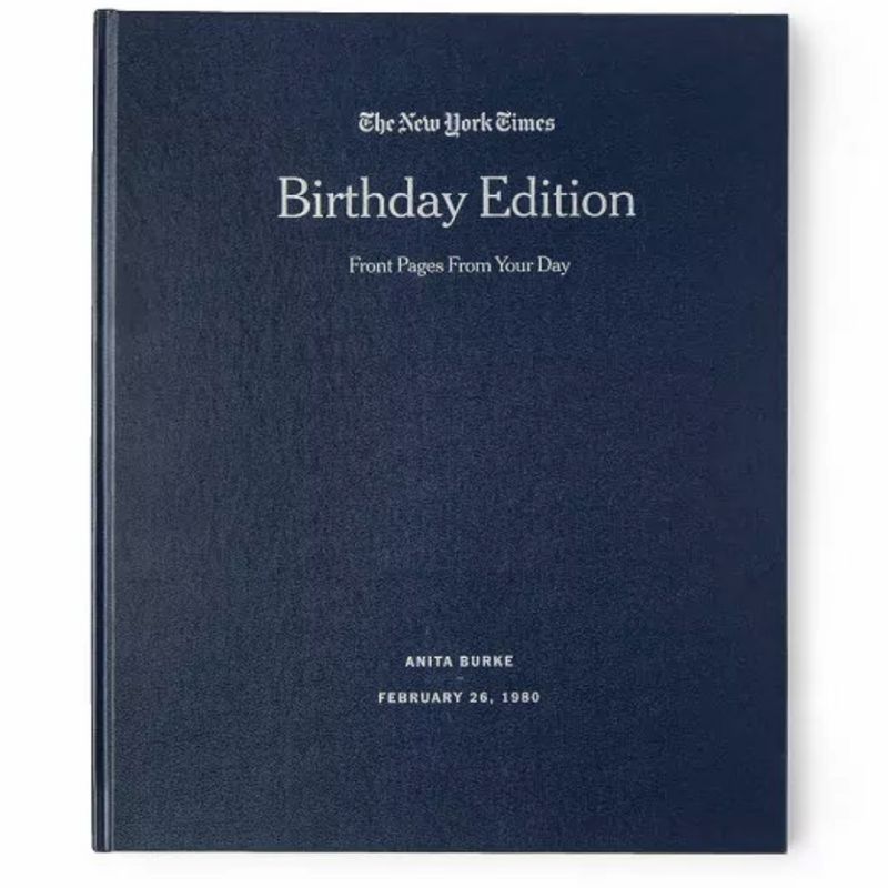 A navy blue New York Times Custom Birthday Book for the best 40th birthday gifts and the best gifts for husbands.