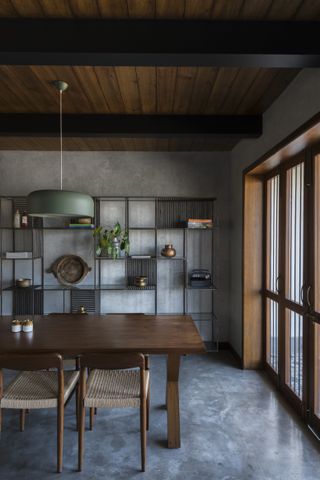 A dining room with concrete floor