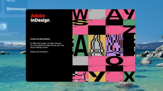 The Adobe InDesign splash screen displays artwork by Beka Bekaia featuring a grid of colorful geometric patterns and abstract letterforms against a black background, set over a desktop wallpaper of a serene mountain lake.