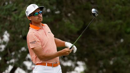 Rickie Fowler looks on after hitting a drive at the Valero Texas Open