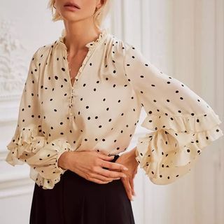 Mint Velvet polka dot blouse on model 