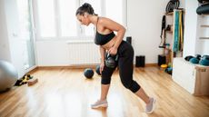 Woman exercising with kettlebell