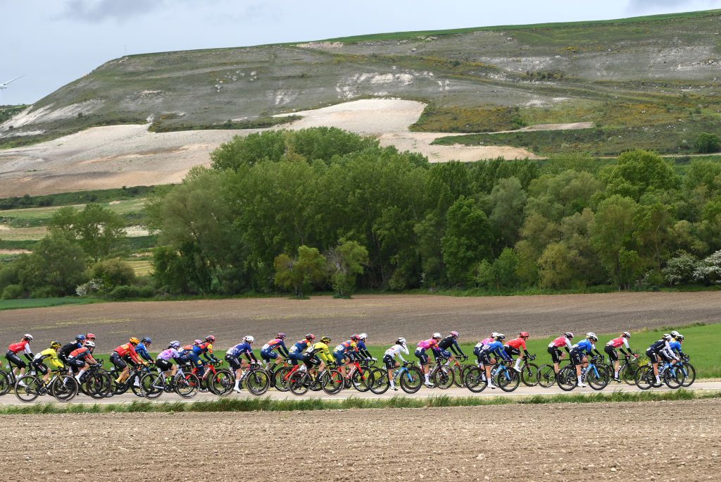 BURGOS SPAIN MAY 16 A general view of the peloton passing through a landscape during the 9th Vuelta a Burgos Feminas 2024 Stage 1 a 123km stage from Villagonzalo Pedernales to Burgos UCIWWT on May 16 2024 in Burgos Spain Photo by Alex BroadwayGetty Images