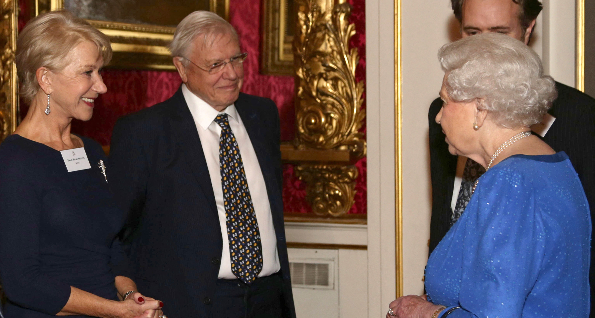 Queen Elizabeth meeting Helen Mirren at a reception