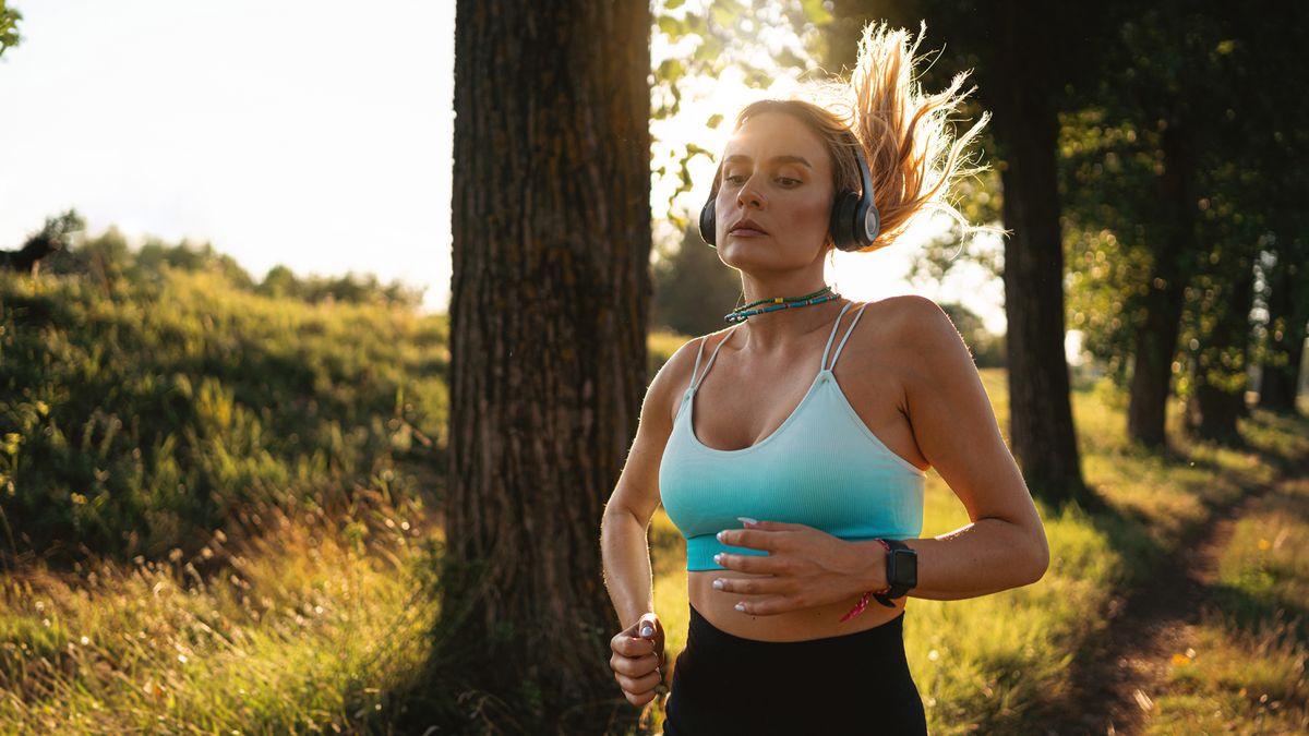 a photo of a woman running outdoors