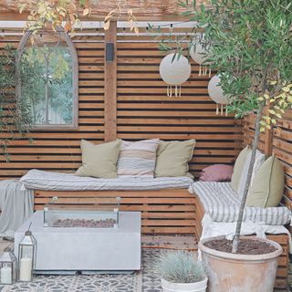fire pit seating area with wooden slatted seating