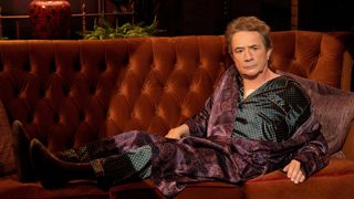 Martin Short as Oliver in Only Murders in the Building season 3, lying on a sofa