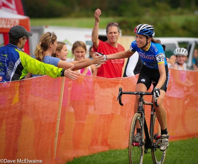 Helen Wyman (Kona Factory Team) is congratulated by the fans at the finish