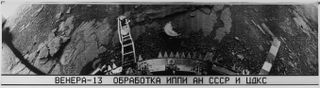 This is an image of Venus from Soviet Venera program probe Venera 13 taken in 1982. The Cyrillic text below the pictures reads: “Venera 13 brabotka IPPI AN SSSR TsDKS,”short for “Venera 13, Processing, Institute for Problems in Transmitting Information, Academy of Sciences, Union of Soviet Socialist Republics, Centre for Long-Distance Space Communications.”