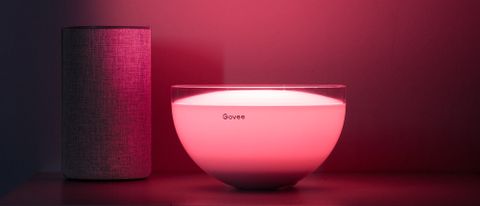 Govee Ambient RGBWW Portable Table Lamp illuminated red on tabletop