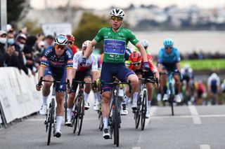 FARO PORTUGAL FEBRUARY 18 Fabio Jakobsen of Netherlands and Team QuickStep Alpha Vinyl green points jersey celebrates winning ahead of Tim Merlier of Belgium and Team AlpecinFenix during the 48th Volta Ao Algarve 2022 Stage 3 a 2114km stage from Almodvar to Faro VAlgarve2022 on February 18 2022 in Faro Portugal Photo by Luc ClaessenGetty Images