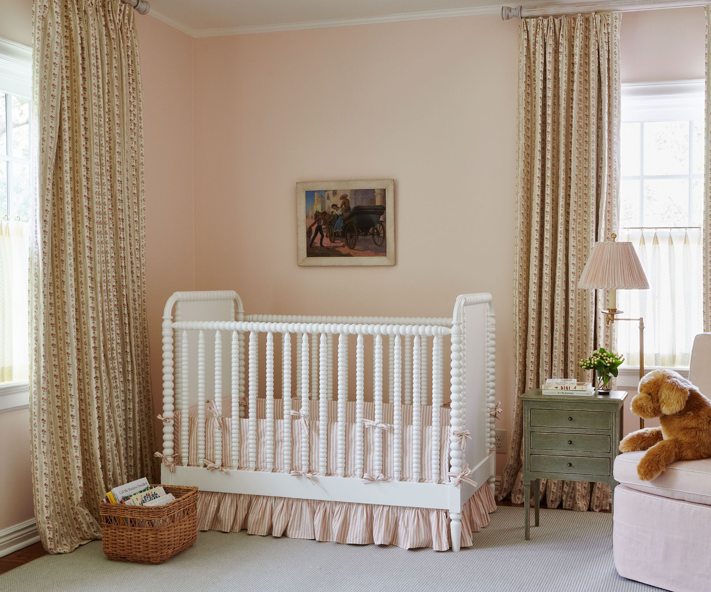 pink nursery with white crib