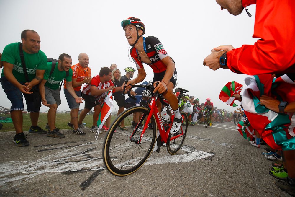 Dylan Teuns clombs durng stage 17 at the Vuleta
