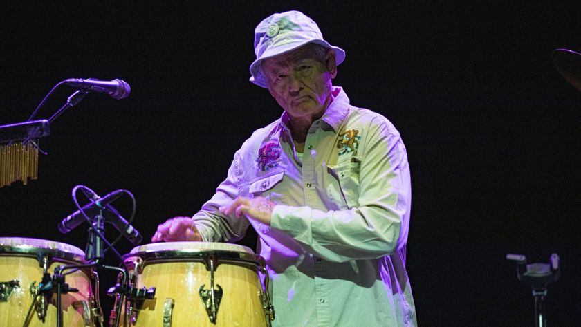 Bill Murray tapping on drums during a performance with his Blood Brothers