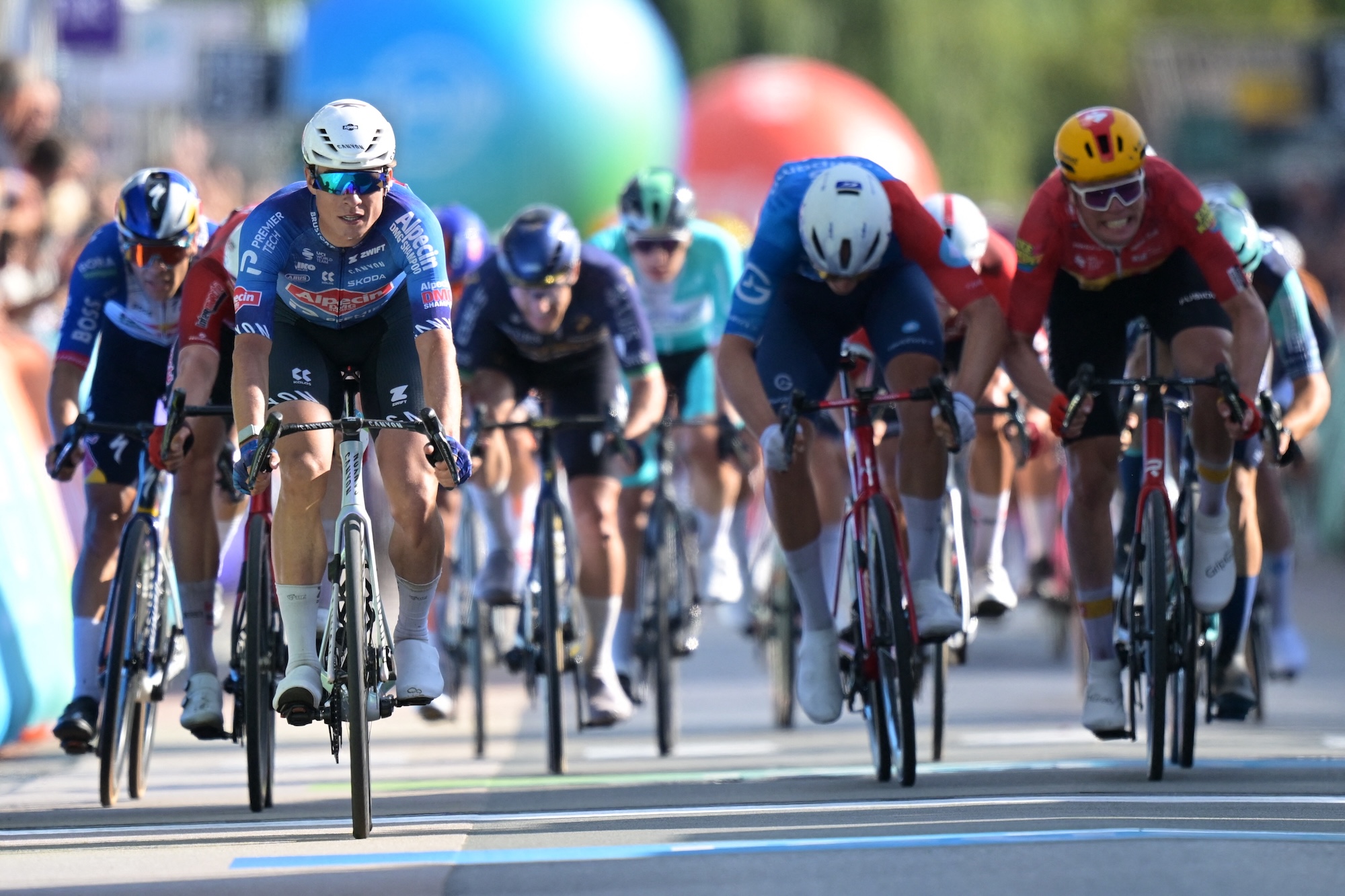 Belgian Jasper Philipsen of Alpecin-Premier Tech celebrates as she crosses the finish line at stage two of the 'Renewi Tour' multi-stage cycling race, from Blankenberge to Ardooie (191,3 km) on Thursday 20 August 2026. The five-day race takes place from 19 to 23/08.BELGA PHOTO DAVID PINTENS (Photo by DAVID PINTENS / BELGA MAG / Belga via AFP)