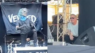 Vended perform while Corey Taylor watches side of stage