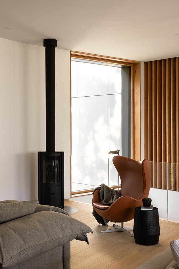 view of Passive House Forest Retreat, a timber structure engulfed in the tree canopy