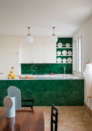 A green tiled kitchen