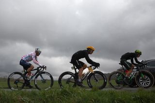 Caja Rural-Seguros RGA's Spanish rider Samuel Fernandez Garcia (R), TotalEnergies' French rider Alexandre Delettre (L) wearing the climber's dotted jersey and Uno-X Mobility's Norwegian rider Jonas Abrahamsen (C) cycle in a breakaway during the 2nd stage of the Paris-Nice cycling race, 183,9 km between Montesson and Bellegarde, on March 10, 2025. (Photo by Anne-Christine POUJOULAT / AFP)