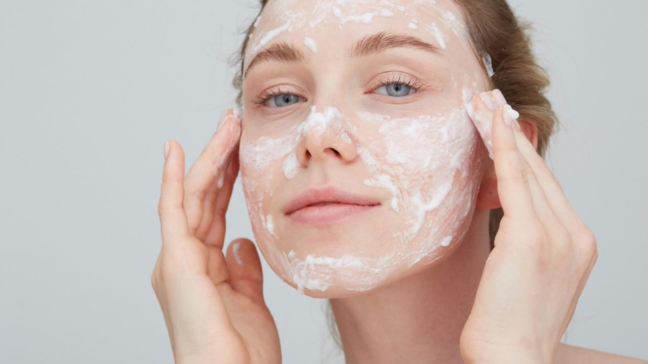 Woman washing her face