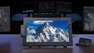 Xencelabs Pen Display 24+ lifestyle product image on a desk with a photo of a mountain on the display 