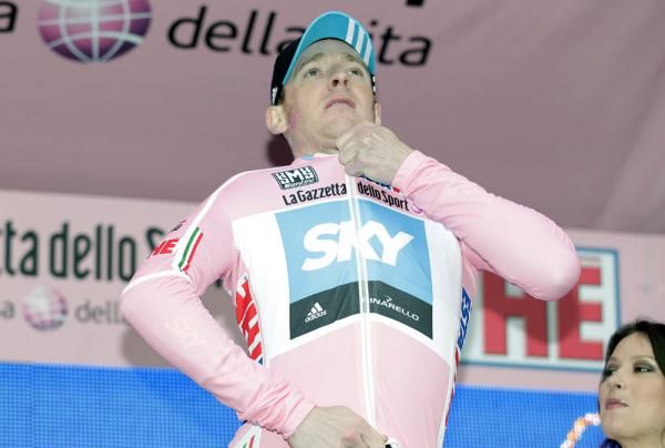 Bradley Wiggins (Team Sky) zips up on the podium