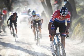 SIENA ITALY MARCH 06 Egan Arley Bernal Gomez of Colombia and Team INEOS Grenadiers Julian Alaphilippe of France and Team Deceuninck QuickStep Mathieu Van Der Poel of Netherlands and Team AlpecinFenix during the Eroica 15th Strade Bianche 2021 Mens Elite a 184km race from Siena to Siena Piazza del Campo Breakaway Gravel Strokes Dust StradeBianche on March 06 2021 in Siena Italy Photo by Tim de WaeleGetty Images