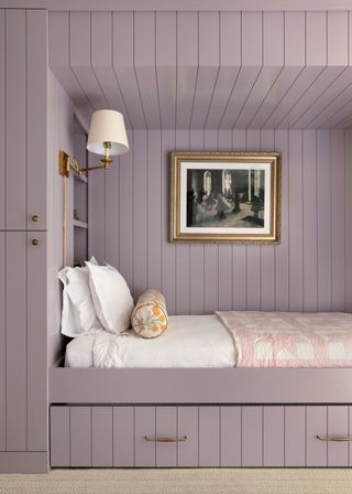 A built-in bed fully painted lavender