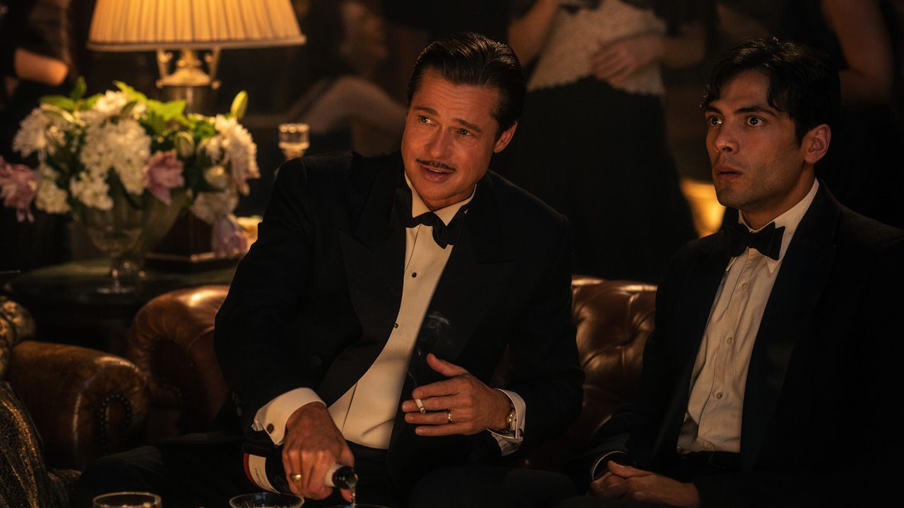 Brad Pitt's Jack Conrad and Diego Calva's Manny Torres talk during an electric party in Babylon