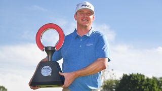 Nate Lashley with the trophy after victory at the Rocket Mortgage Classic