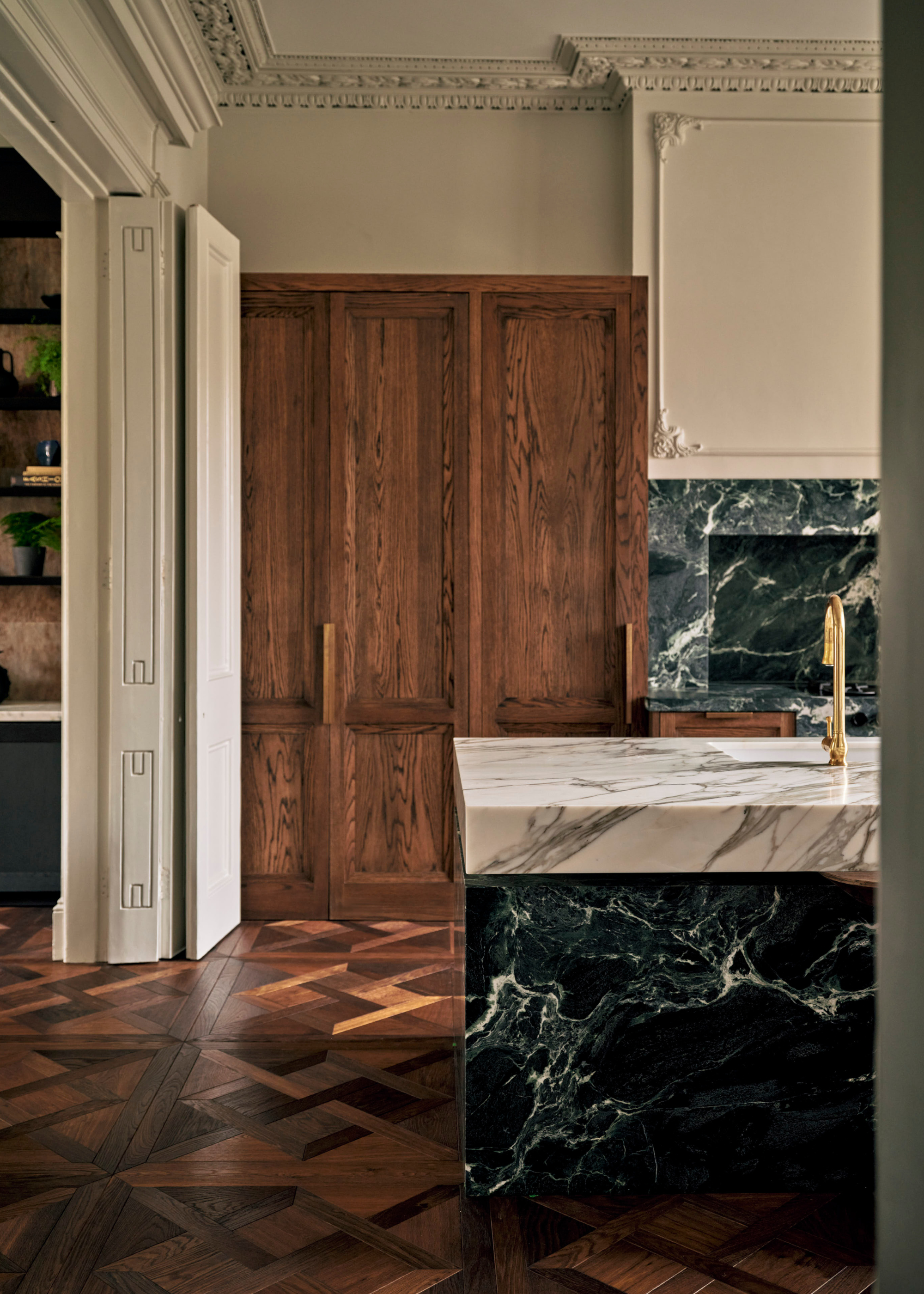 gorgeous victorian home kitchen with wooden cabinets and mixed marble kitchens surfaces