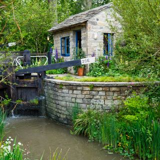 brown brick house near river