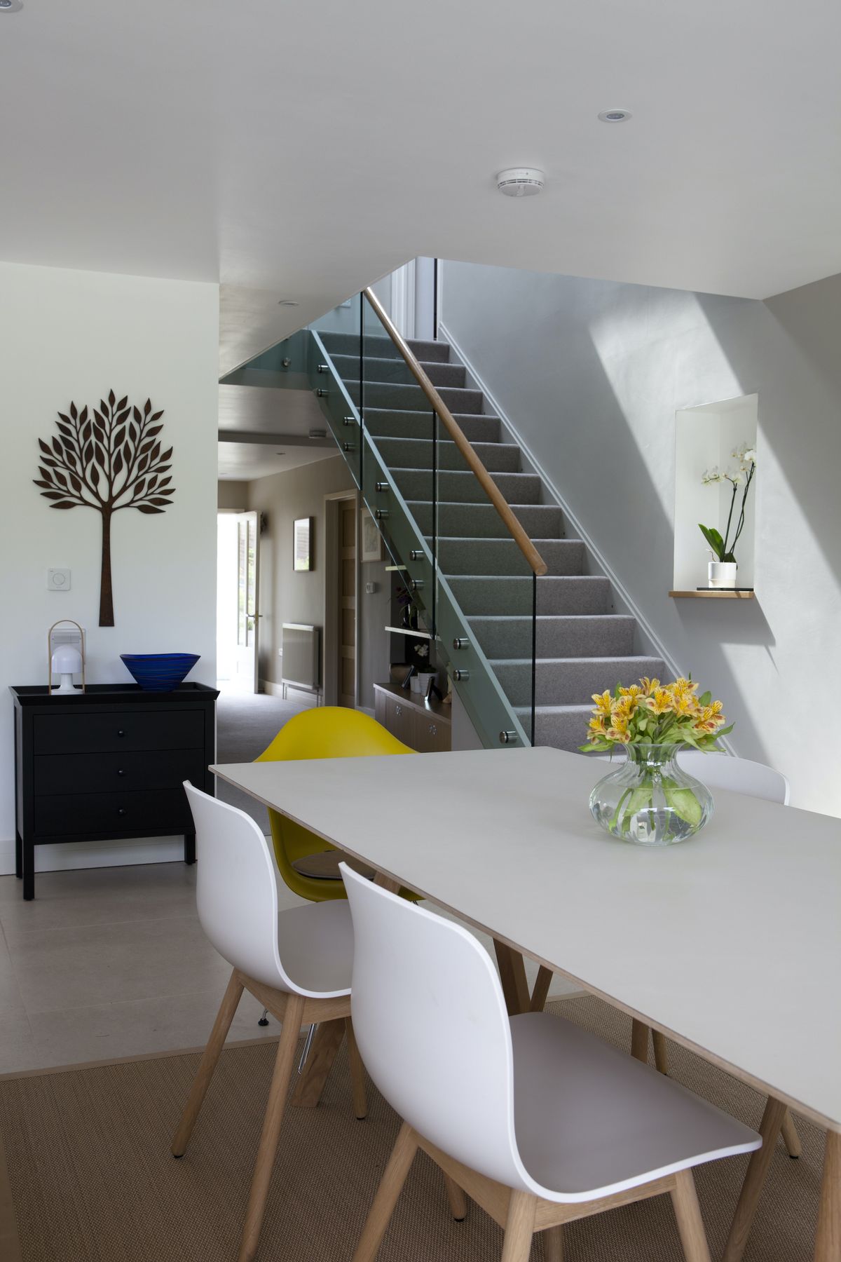 Rotating the staircase and moving a small bathroom allowed the Sutcliffes to create a thoroughfare to this newly created, open-plan space.