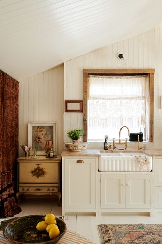 Traditional cream kitchen with antique accessories