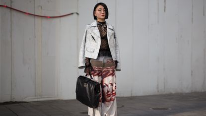 stylish woman carrying a laptop bag